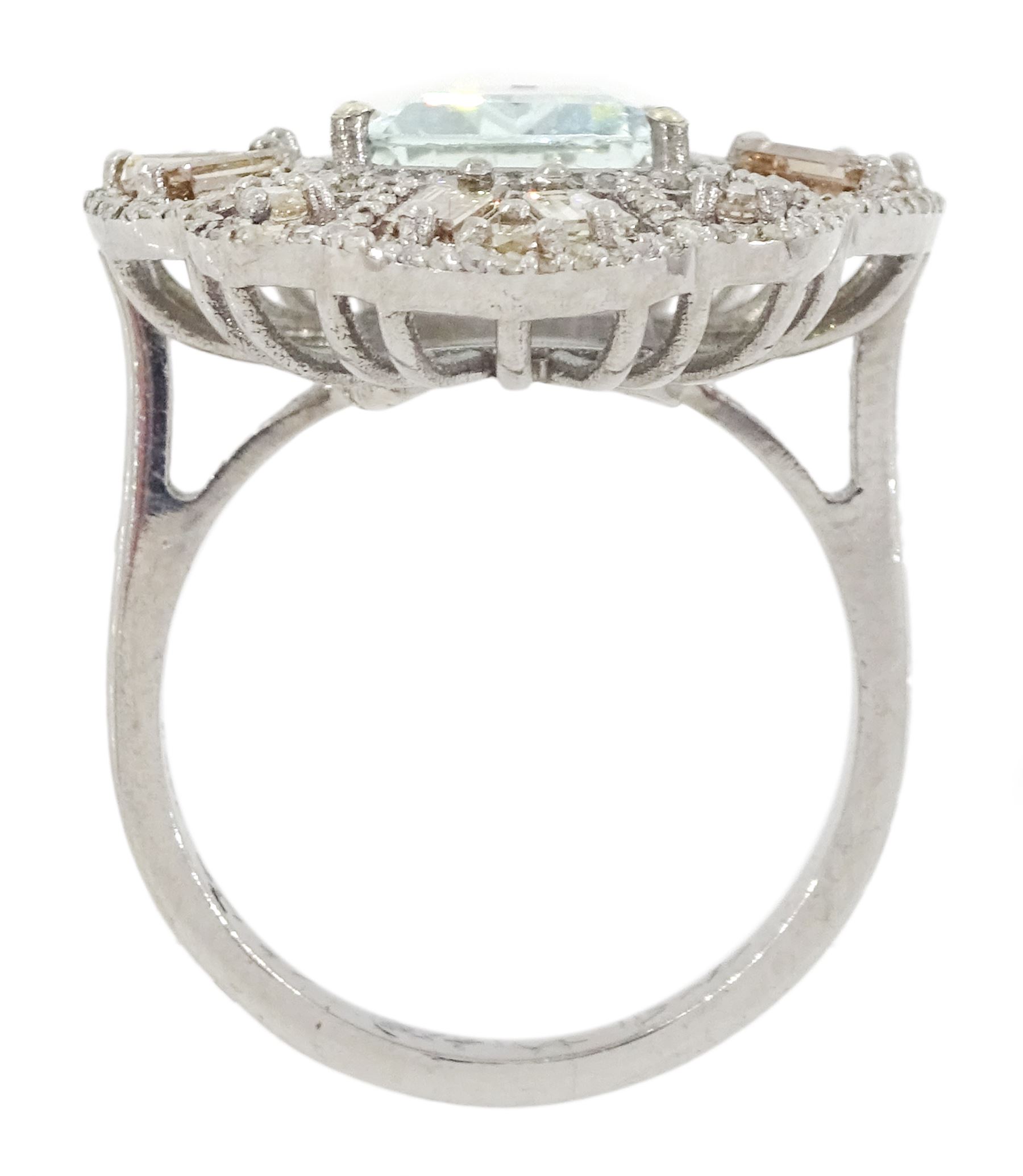 Large silver aquamarine and diamond pierced design ring, the central emerald cut aquamarine of approx 3.75 carat, with baguette and round brilliant cut diamond surround, total diamond weight approx 1.75 carat