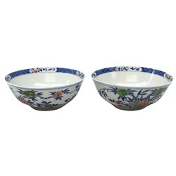 Pair of 20th century Chinese bowls, with enamelled floral decoration, and character mark beneath, D18cm
