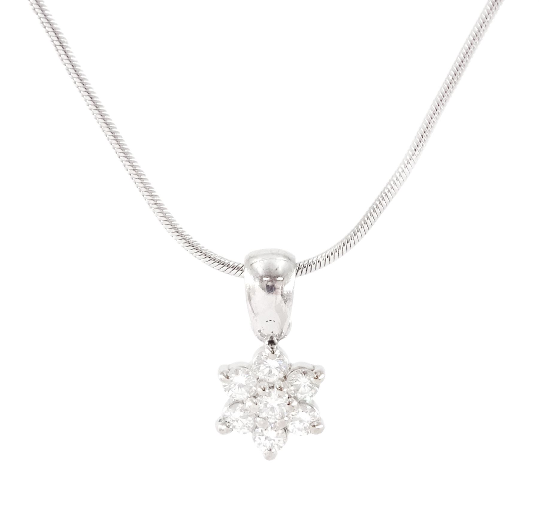 18ct white gold seven stone round brilliant cut diamond daisy flower head cluster pendant, on 9ct white gold chain, total diamond weight approx 0.30 carat