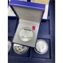 Nine commemorative coins relating to the France 1998 World Cup, some cased with certificates, in a blue coin storage box