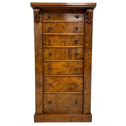 Victorian burr walnut Wellington chest, rectangular top with book-matched veneers, two hinged uprights with scrolled foliage carved brackets enclosing seven graduating drawers, on plinth base 