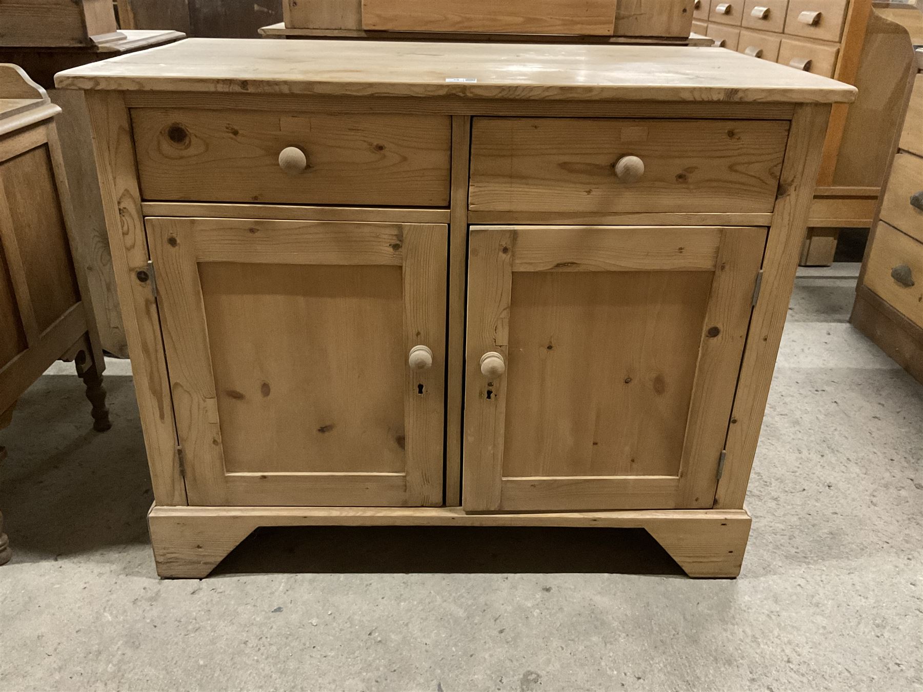 Traditional pine cupboard, fitted with two drawers over two panelled cupboards  - THIS LOT IS TO BE COLLECTED BY APPOINTMENT FROM THE OLD BUFFER DEPOT, MELBOURNE PLACE, SOWERBY, THIRSK, YO7 1QY