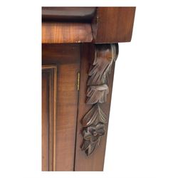 Mid 19th century mahogany sideboard, rectangular top over two frieze drawers with rounded edges, flanked by floral carved corbels, over two panelled cupboard doors, raised on a plinth base