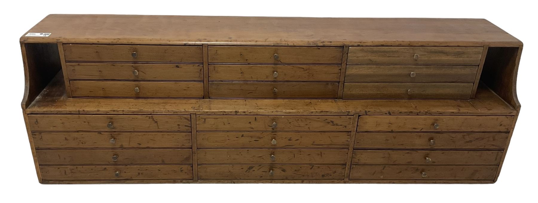 Late 19th century stained beech Solicitor's desktop bank of correspondence drawers, two-tiered, fitted with twenty one drawers, together with related brass plaques