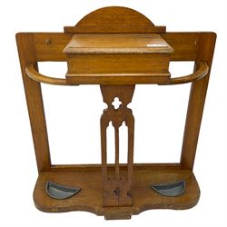 Arts & Crafts period golden oak hallstand, central glove compartment with moulded hinged top, over a Gothic pierced splat, flanking curved umbrella or stick stands