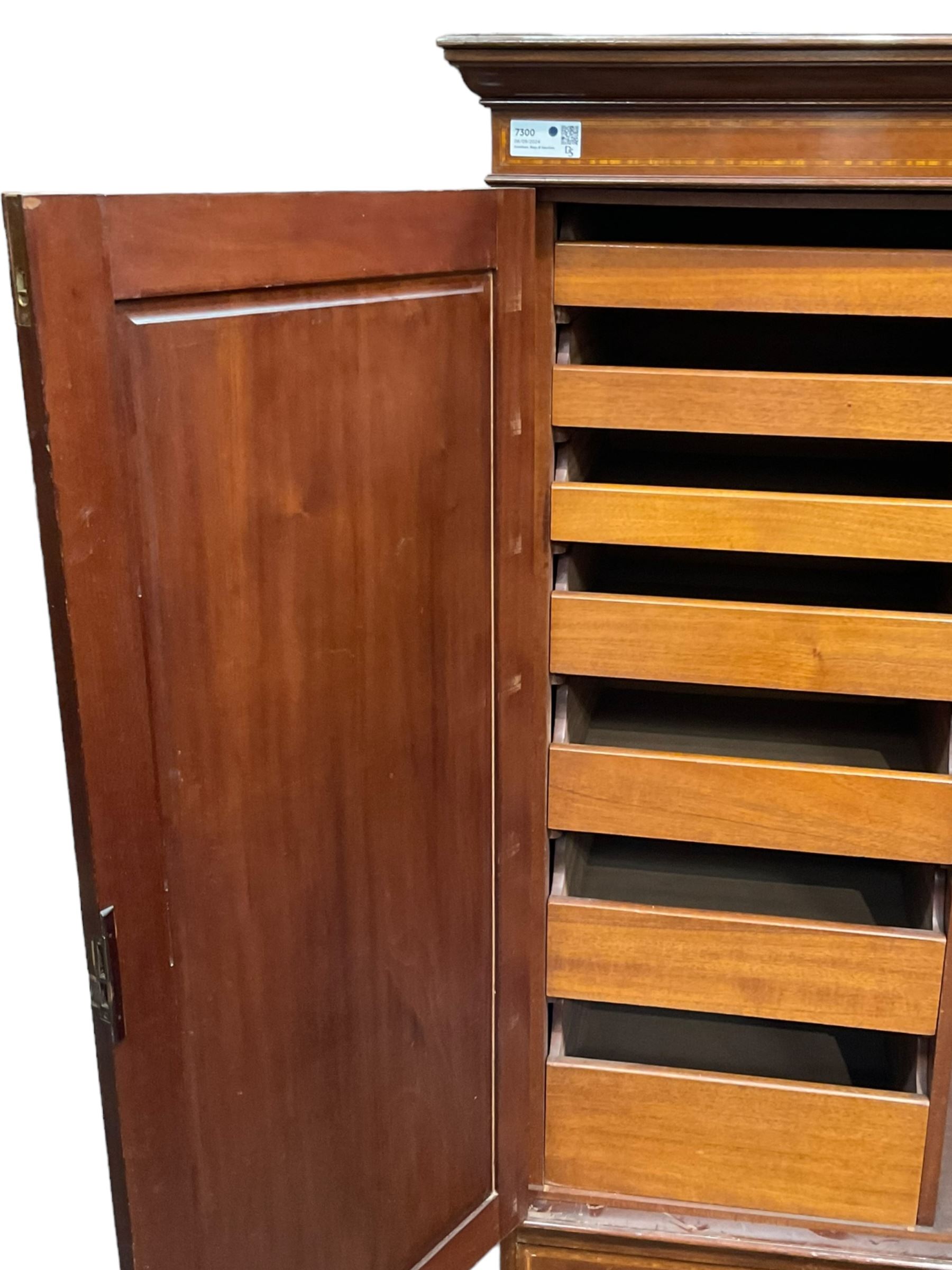 Edwardian inlaid mahogany double wardrobe, panelled doors enclosing sliding trays and hanging rail, fitted with single drawer to base