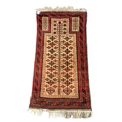 Baluch red and light brown ground prayer rug, decorated with stylised plant motifs 