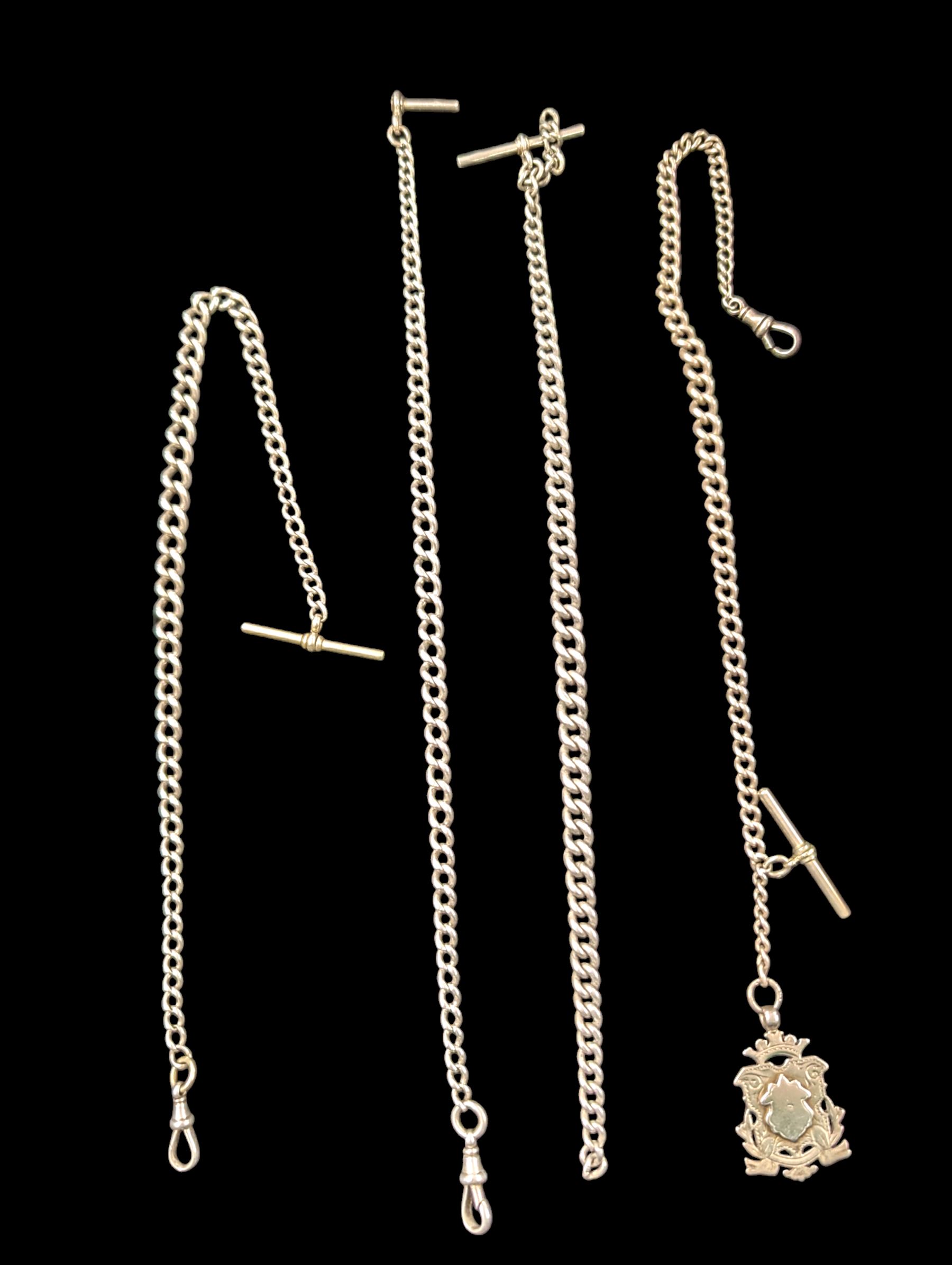 Four silver Albert chains, including curb link example with silver  fob and two with plated t-bars, all silver stamped or hallmarked 