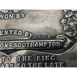 Silver presentation plaque, the Toogood Championship Shield, embossed with lion and flowers, mounted upon a velvet easel style support, hallmarked H17cm