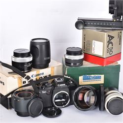 Canon T60 camera body serial no 25230455 together with a collection of Canon camera accessories, including zoom lenses, bellows, etc 