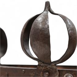 Late 19th to early 20th century Arts & Crafts wrought metal and copper coal or log basket, hammered metal frame, on four supports with bulbous onion finials terminating to pad feet, the frame decorated and united by curled stylised leaf pattern, the copper inner decorated with cabochons mounts, fitted with metal liner 