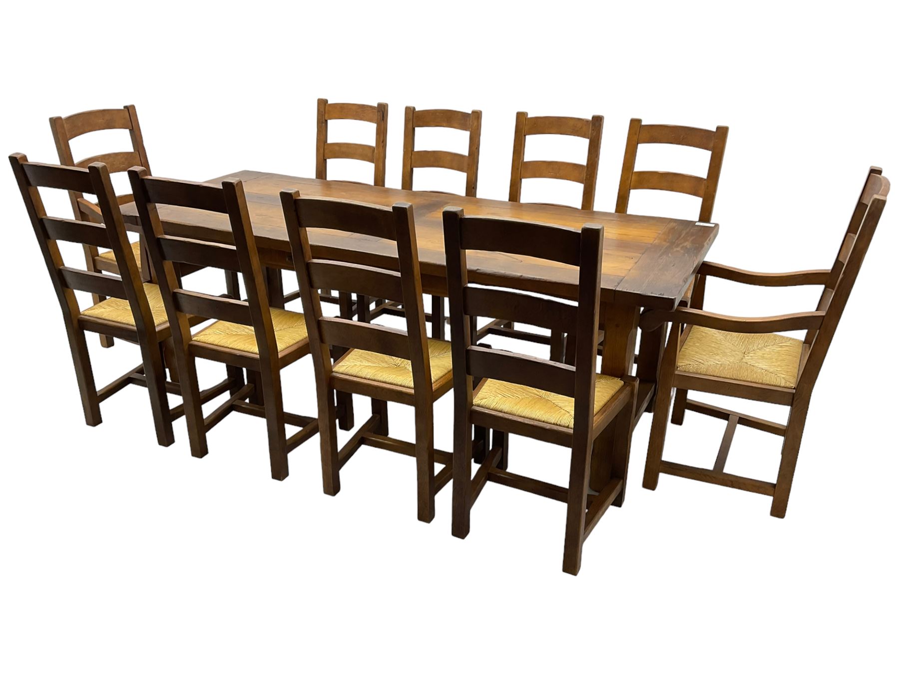 Antix Furniture - oak extending refectory dining table, rectangular plank top with two additional leaves and two drawers to the longer side, on square supports connected by H-stretcher; set of ten (8+2) ladder back dining chairs with rush seats