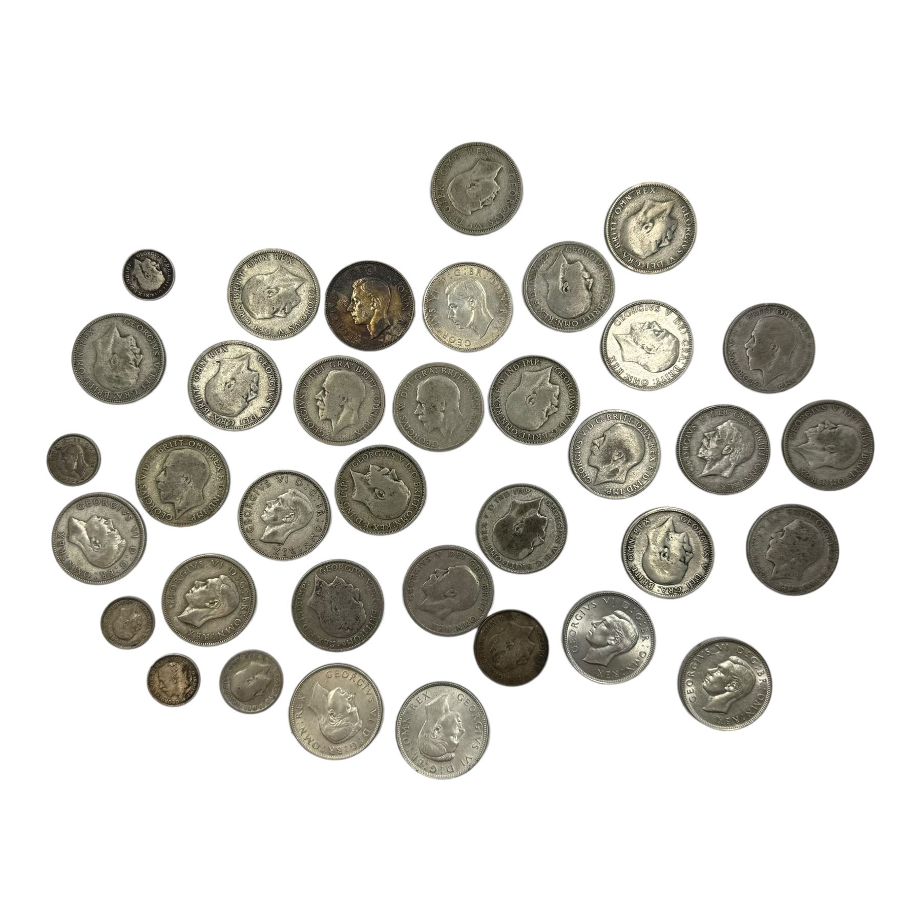 Approximately 345 grams of Great British pre 1947 silver coins, including two shillings or florins, threepence pieces etc