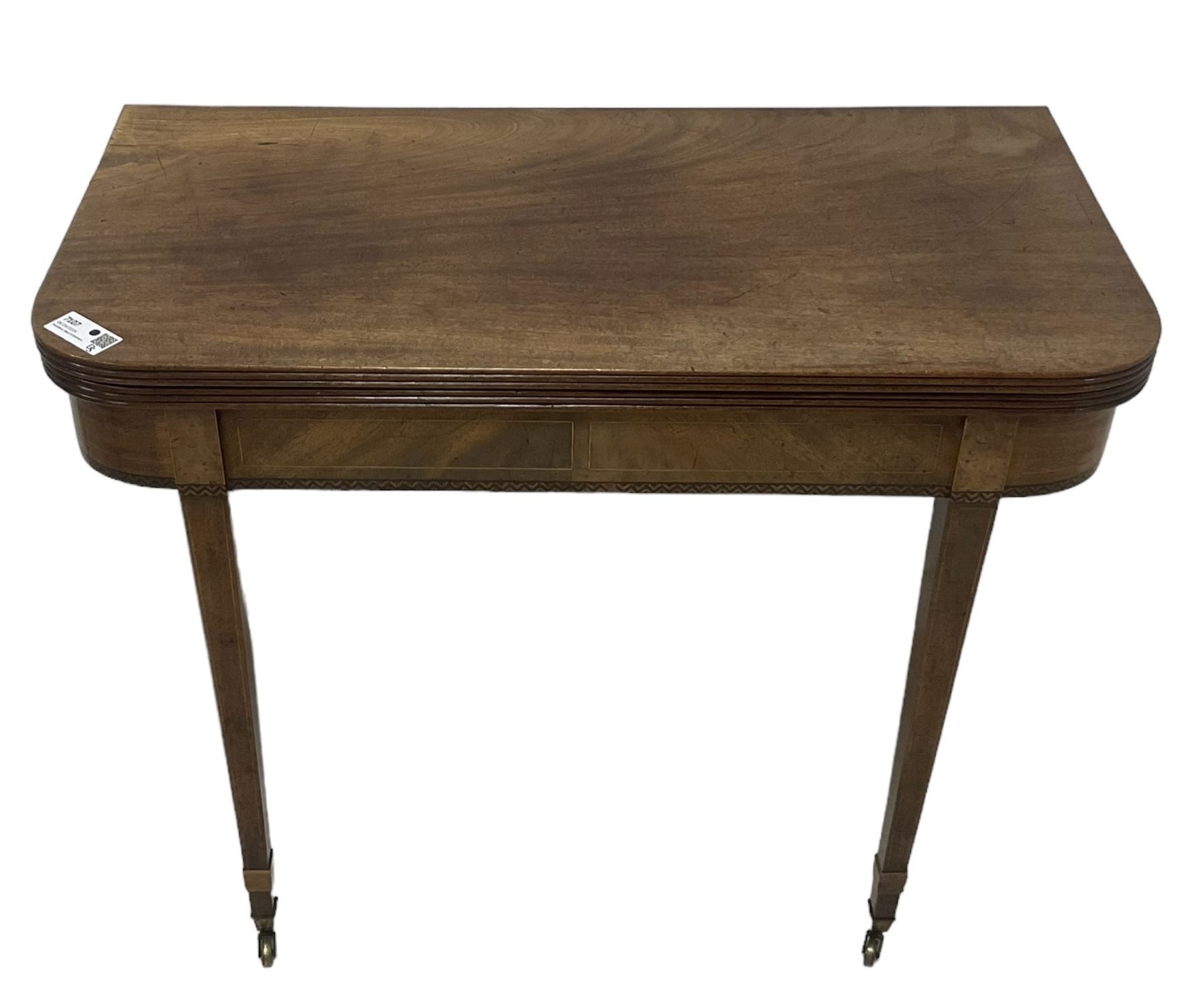 19th century mahogany tea table, fold-over top with reeded edge over inlaid frieze, on double gate-leg action square tapering supports, with brass castors