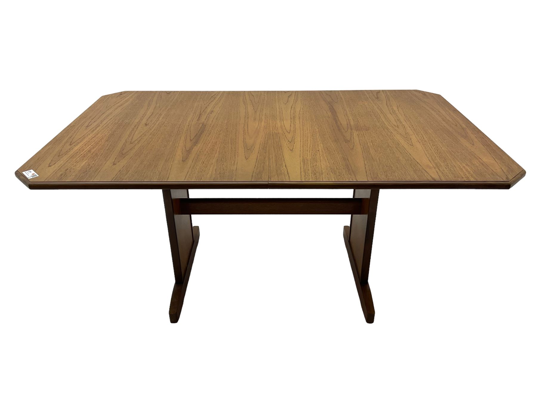 G-Plan -  1970s teak extending dining table, pull-out extending action with fold-out leaf, rectangular end supports on sledge feet united by stretcher (100cm x 160cm - 205cm, H73cm); set of six dining chairs, chevron-patterned backrests upholstered with floral patterned fabric, on tapered legs, H89cm