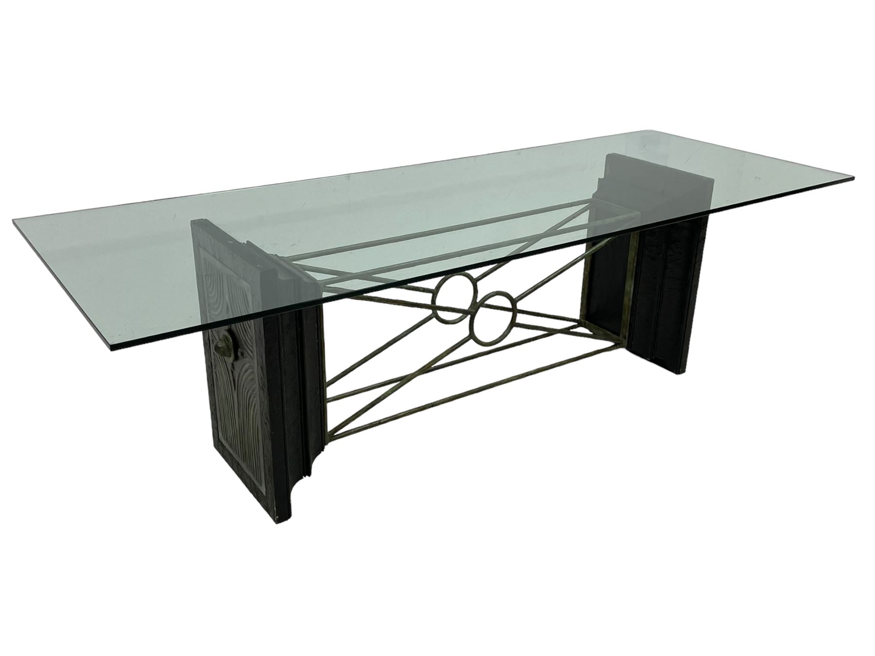 Tempus Stet - 'The Corinth Architectural' dining table, rectangular glass top on moulded composite end supports inset with bronzed metal panels, united by metal stretchers 