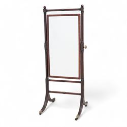 Early 19th century mahogany cheval mirror, ring turned frame with globular finials enclosi...