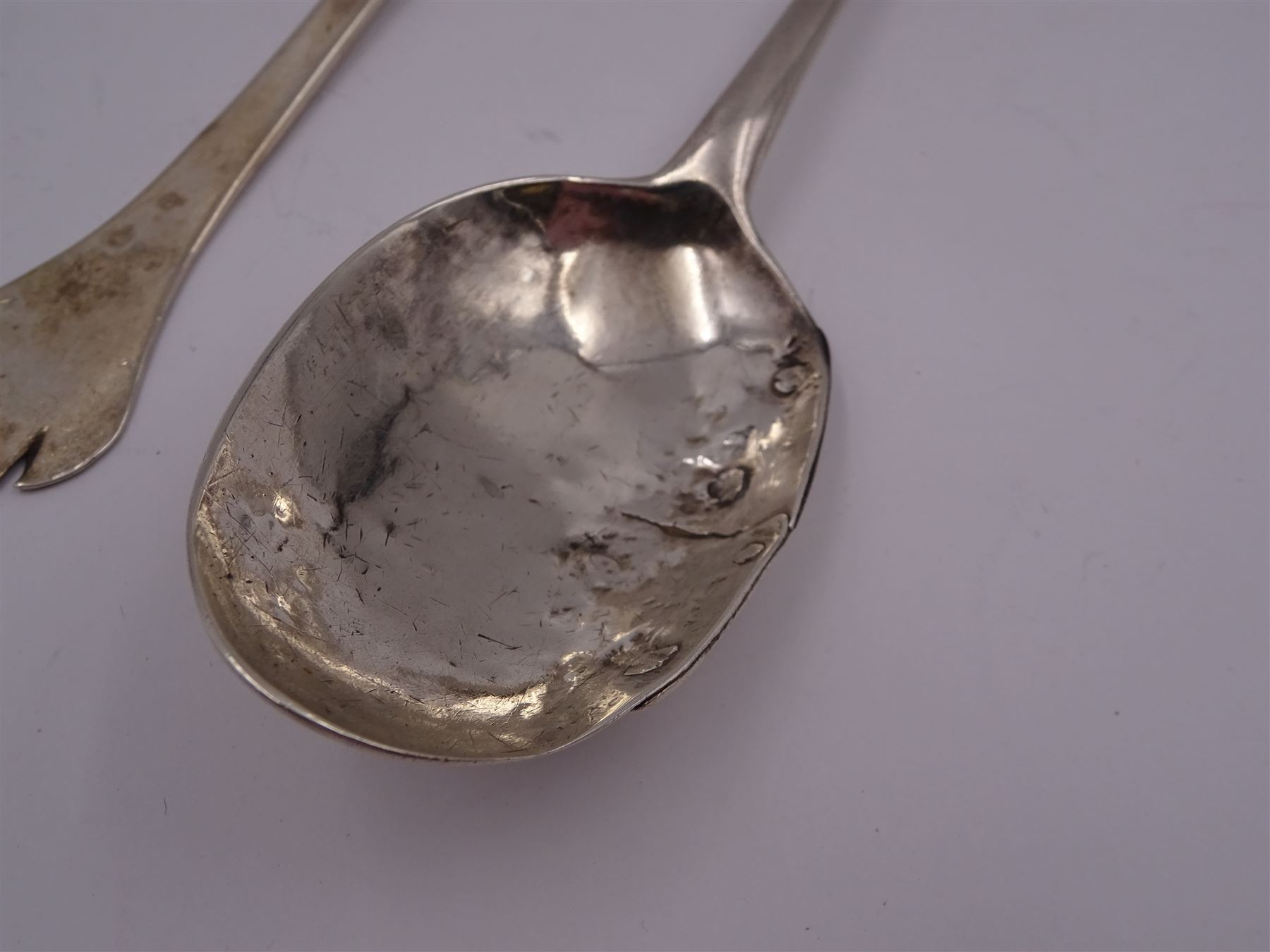 17th century silver trifid spoon, marks worn and indistinct, together with an Old English pattern silver spoon