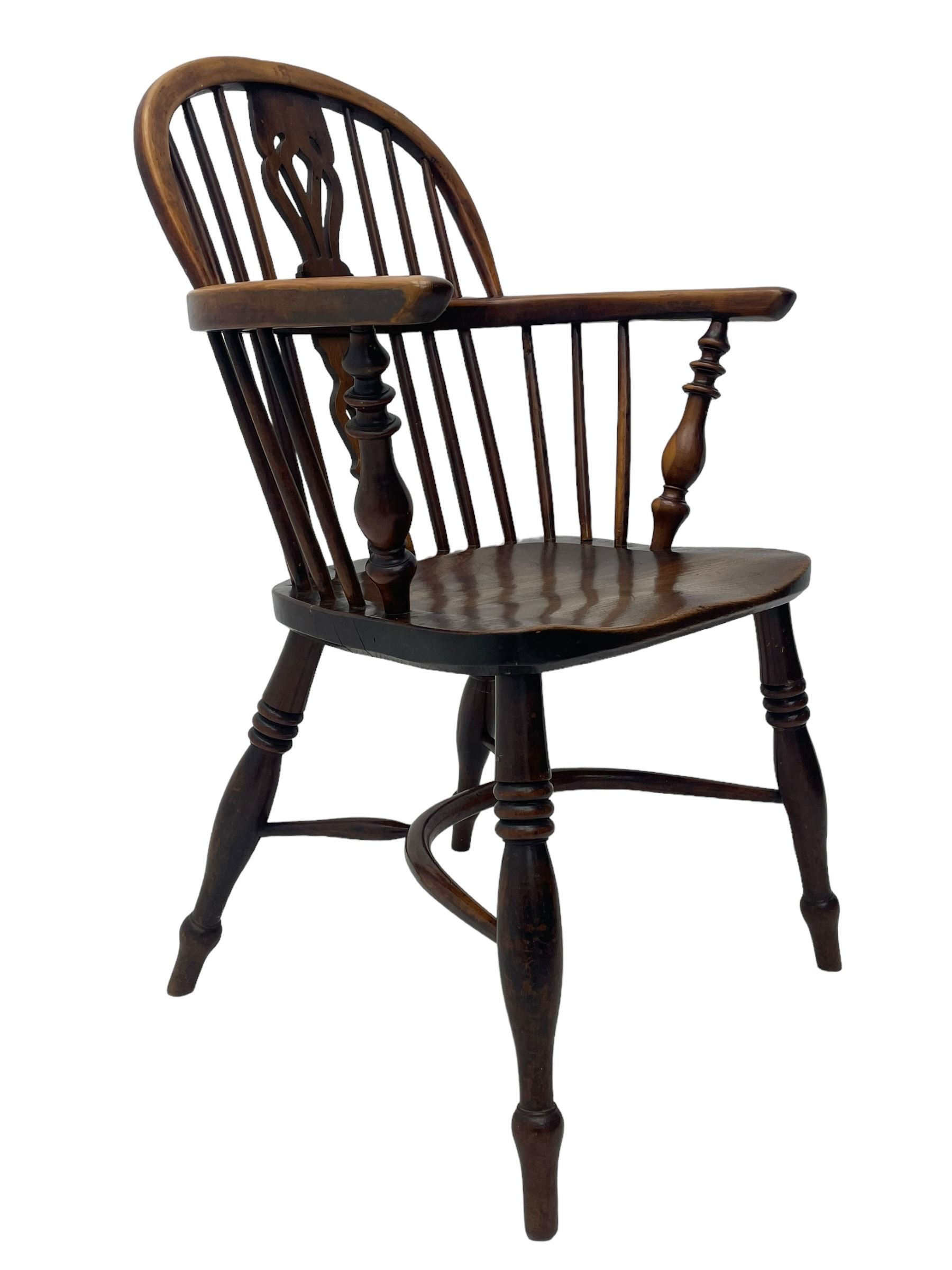 19th century yew wood and elm Windsor armchair, low double hoop stick and pierced splat back, dished seat on turned supports united by crinoline stretchers