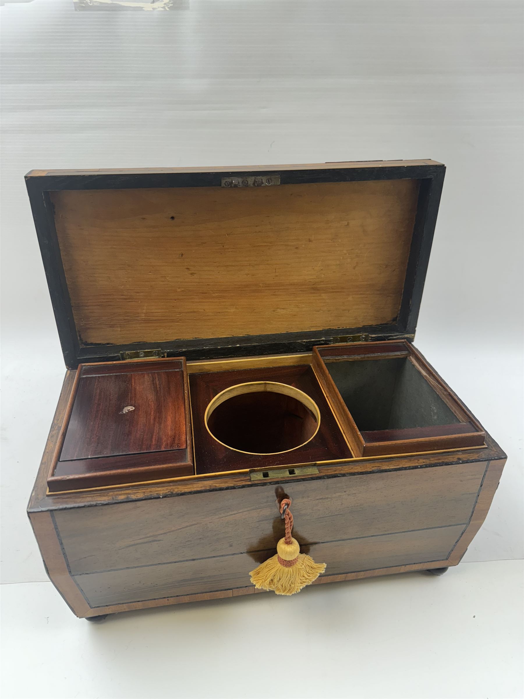 Georgian sarcophogus shaped tea caddy, with inlaid panels and twin lion mask handles, with mahogany compartmentalised interior, upon four bun feet, H22cm