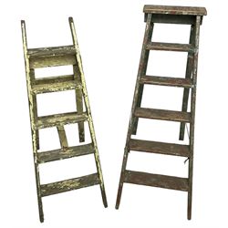 Late 19th century painted pine six tread library or shop step ladder (W52cm H136cm); together with another similar (W45cm H129cm)