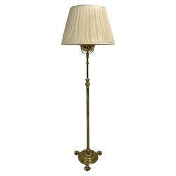 Edwardian brass plated copper standard lamp, telescopic stem on lobe moulded circular base...