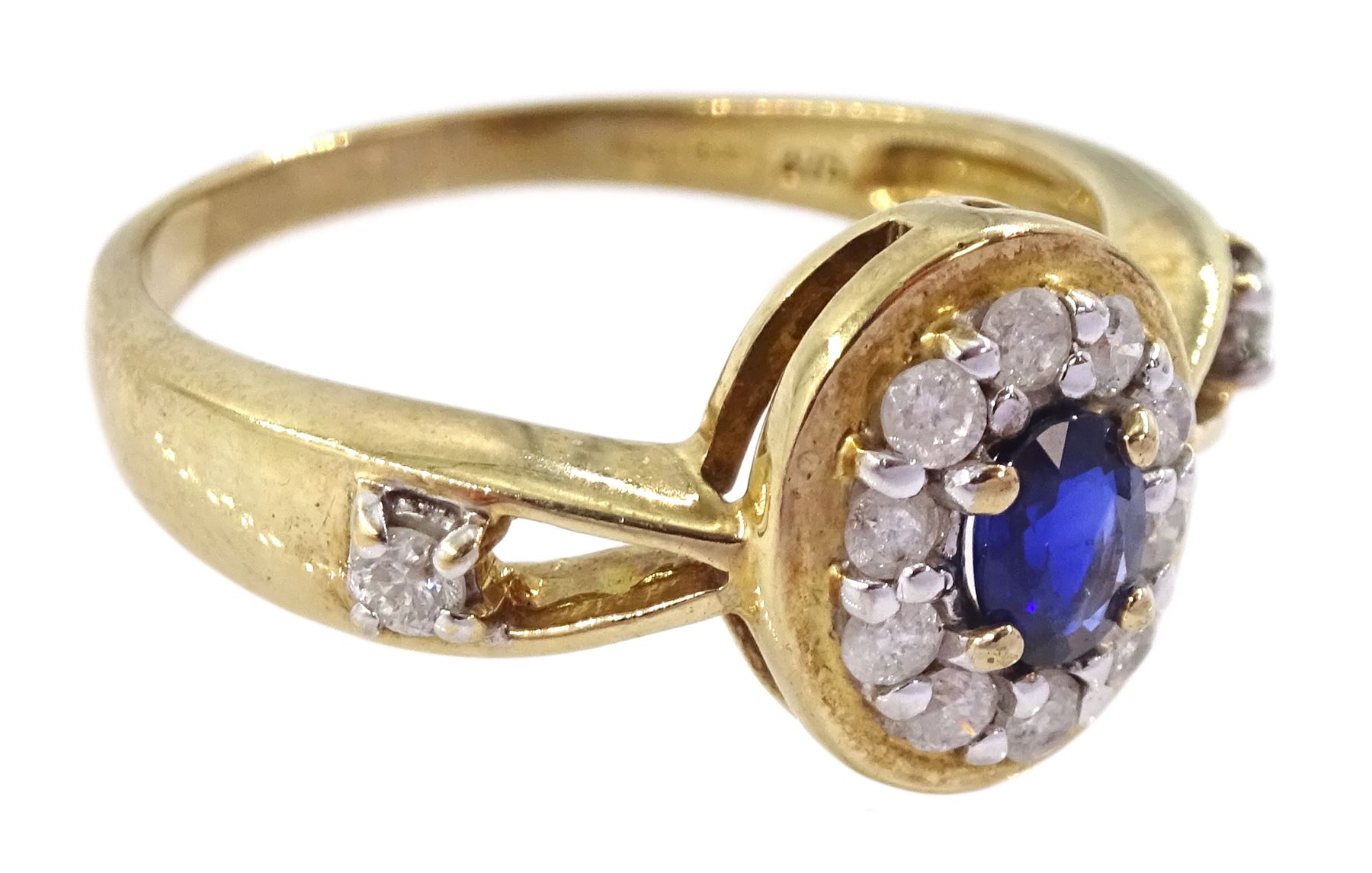 9ct gold oval cut sapphire and round brilliant cut diamond cluster ring, with diamond set shoulders, hallmarked