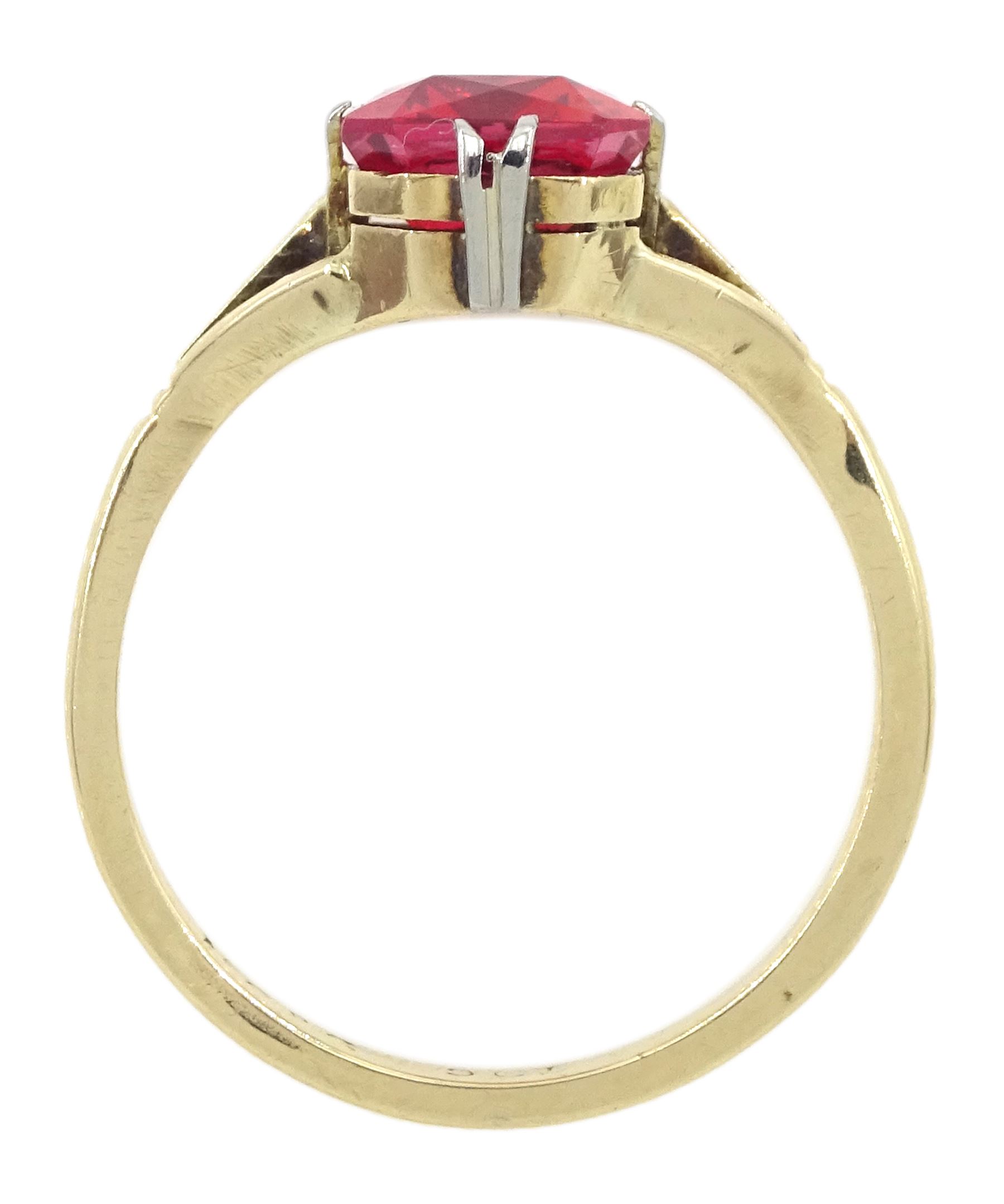 9ct gold single stone emerald cut red-orange sapphire ring, with forked shoulders