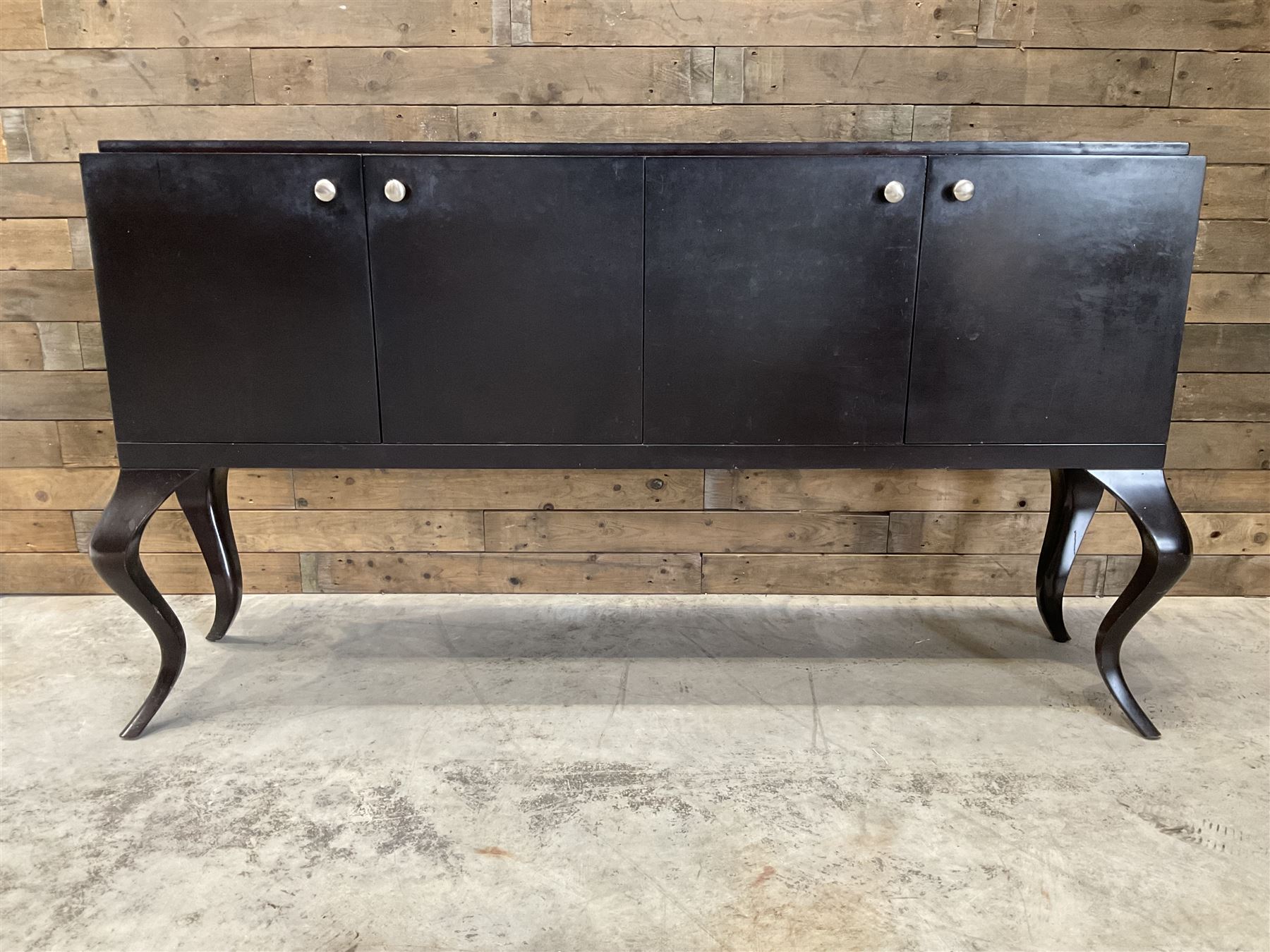 Rosewood finish four door sideboard, on cabriole legs