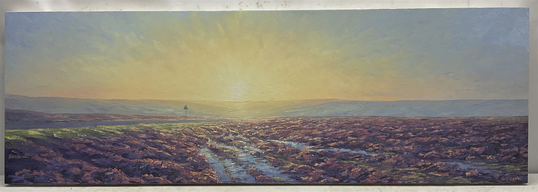 Christopher Geall (British 1965-): Sunrise over the Moors, oil on canvas signed 51cm x 150cm 