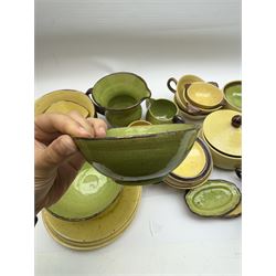 French green and yellow glazed tea and dinner wares by Etienne Noel, including milk jugs, teacups, side plates, bowls etc (43)