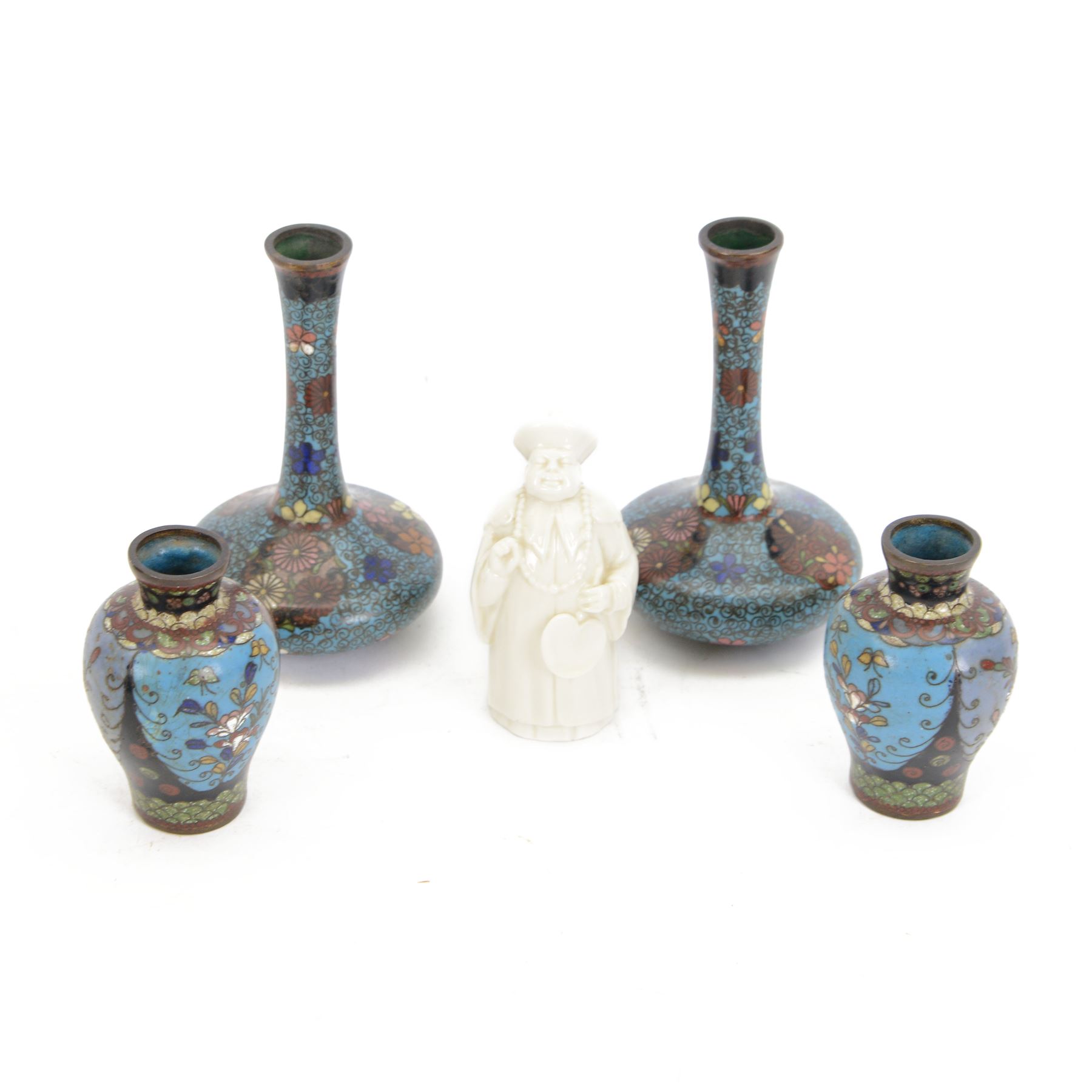 Pair of small Japanese Cloisonne bottle form vases, each decorated with foliate panels against a blue ground, H13cm, a similar pair of Japanese Cloisonne vases and Royal Worcester candle snuffer in the form of a Chinese man holding a fan, H9cm (5)