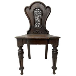 Victorian oak hall chair, the shaped back with fretwork splat, stepped moulded seat on turned lappet supports with fluting 