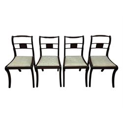 Set of four Regency mahogany dining chairs, rope twist and bead turned cresting rail over reeded middle rail, upholstered drop-in seat, reeded frame and sabre supports