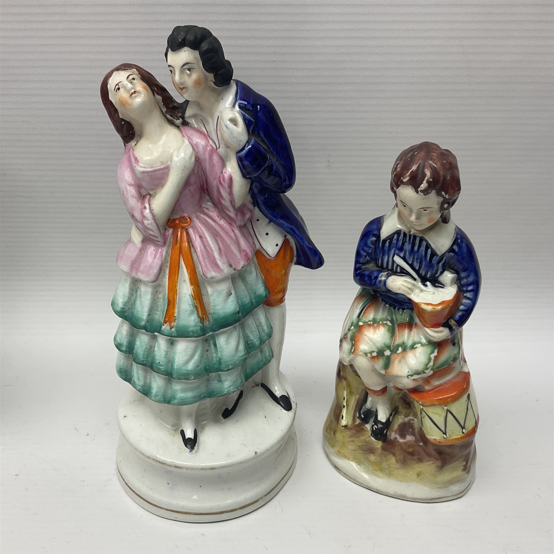 Collection of 19th century and later Staffordshire figures, including figure of a spill vases, figure groups and houses, tallest H28cm (11)