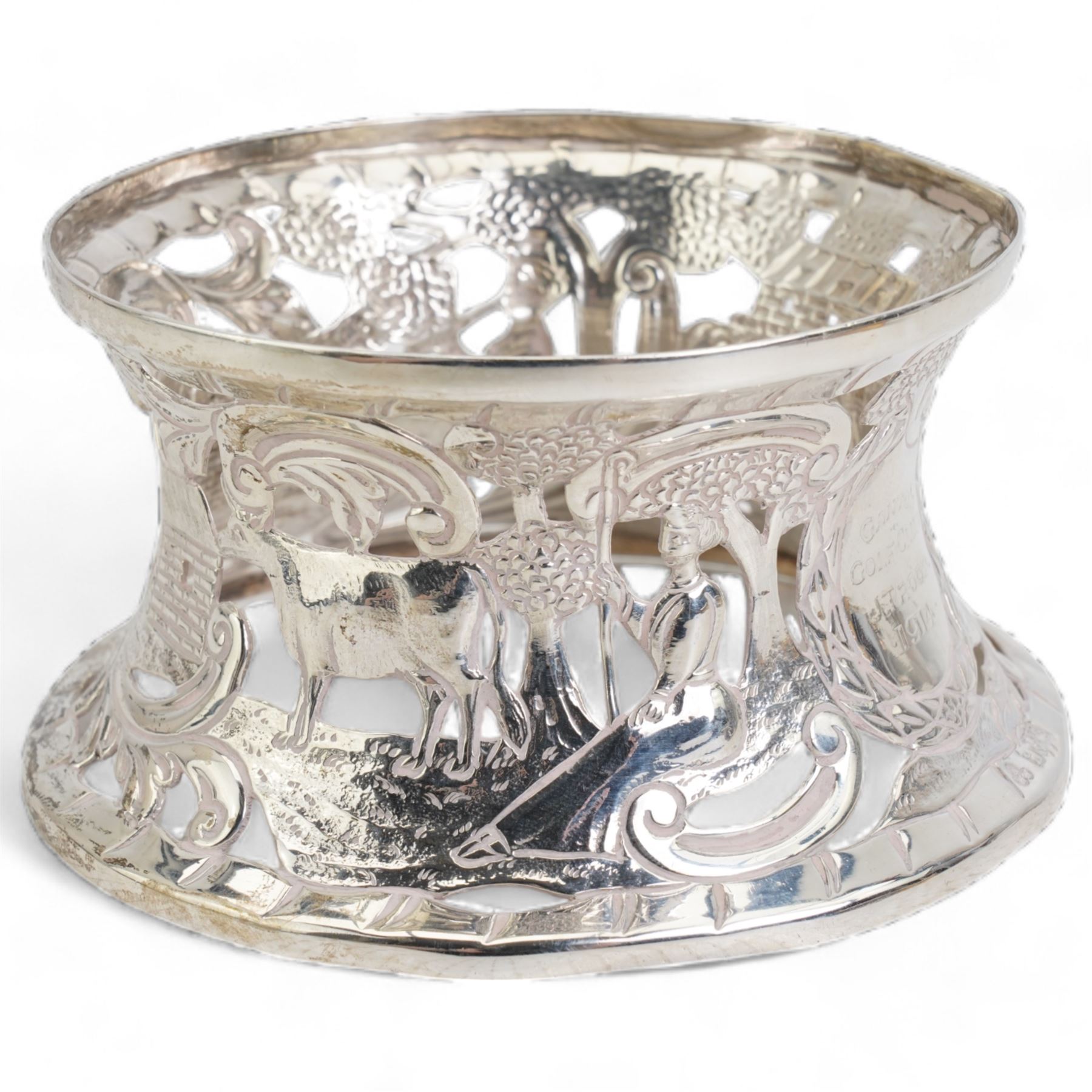 Silver miniature presentation dish ring, pierced and engraved with a pastoral scene, engraved 'Ganton Golf Club, J.T. Roop, 1914, hallmarked Wakely & Wheeler, Dublin 1913, H6cm, D11cm