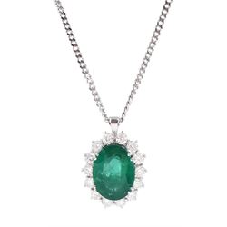 18ct white gold oval cut emerald and round brilliant cut diamond, cluster pendant necklace...