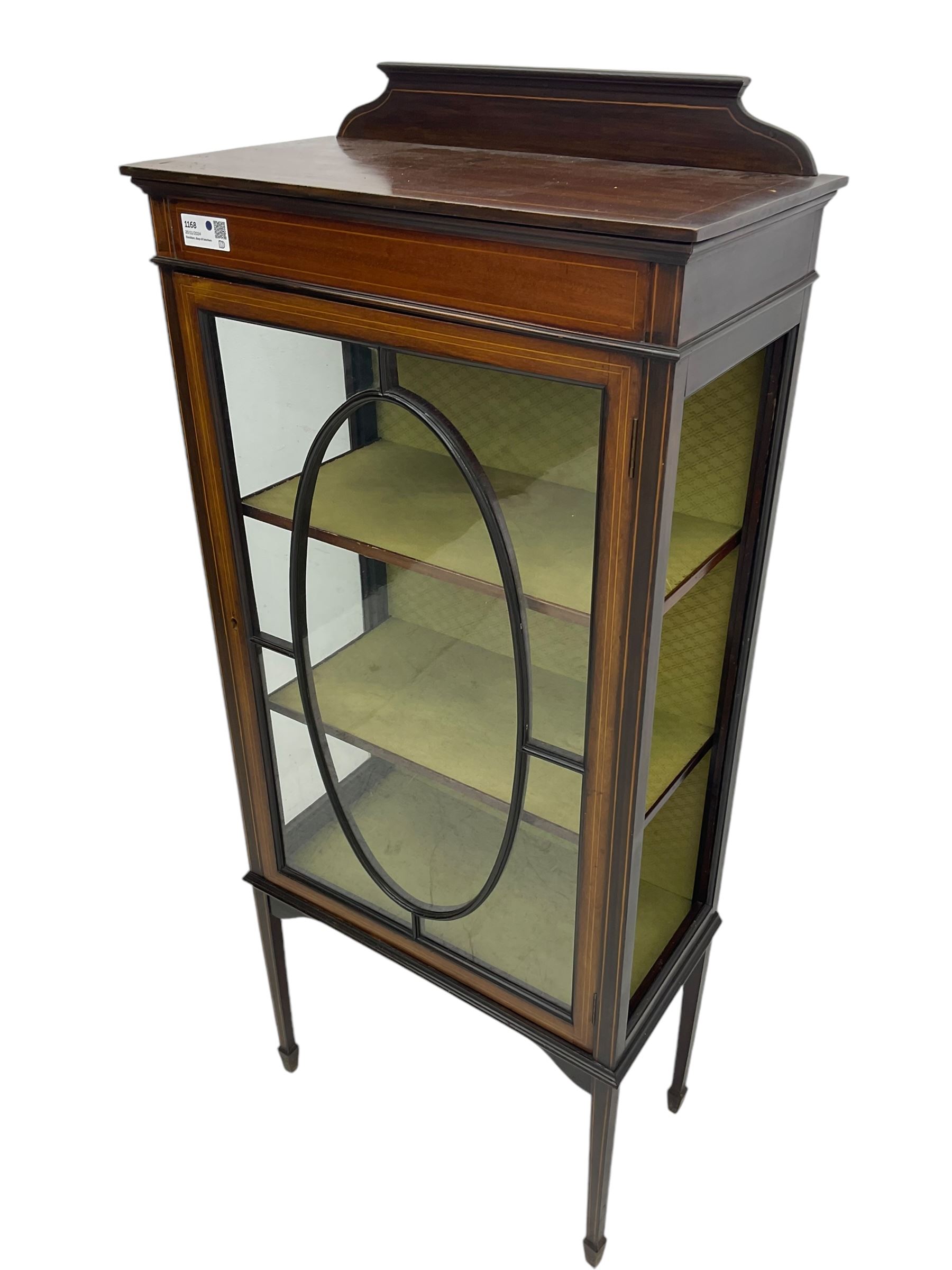 Edwardian inlaid mahogany display cabinet, shaped and raised back over single astragal glazed door, interior lined and fitted with two shelves, raised on square tapering supports