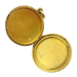 Gold circular locket and a gold cross, both hallmarked 18ct, approx 7.8gm