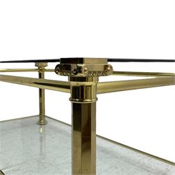 Gilt metal and bevelled glass two-tier coffee table, the faceted supports with Ionic Capitals