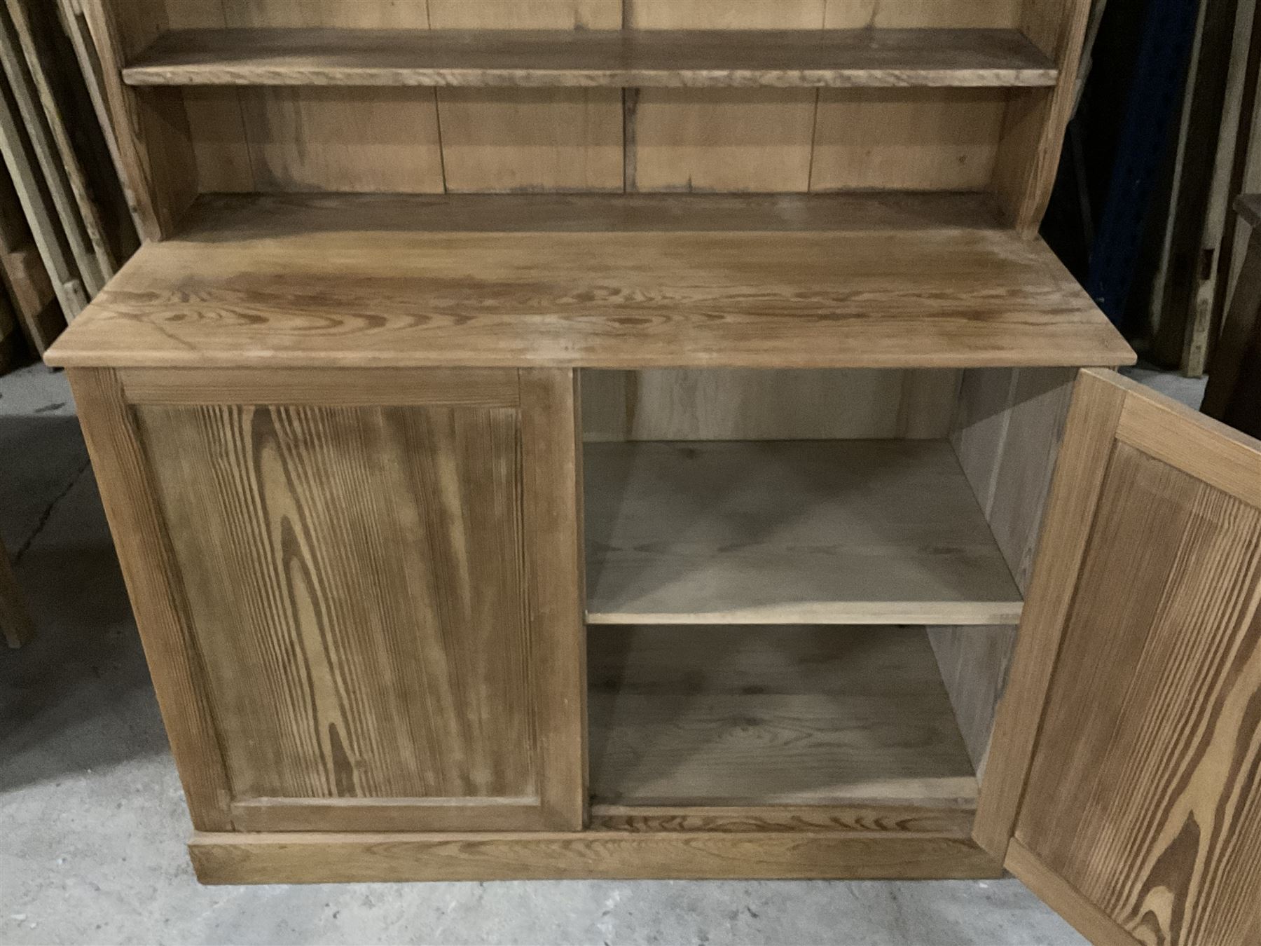 Late Victorian pitch pine dresser, moulded cornice over raised panelled cupboard and shelf, rectangular top over double panelled cupboard, on skirted base - THIS LOT IS TO BE COLLECTED BY APPOINTMENT FROM THE OLD BUFFER DEPOT, MELBOURNE PLACE, SOWERBY, THIRSK, YO7 1QY