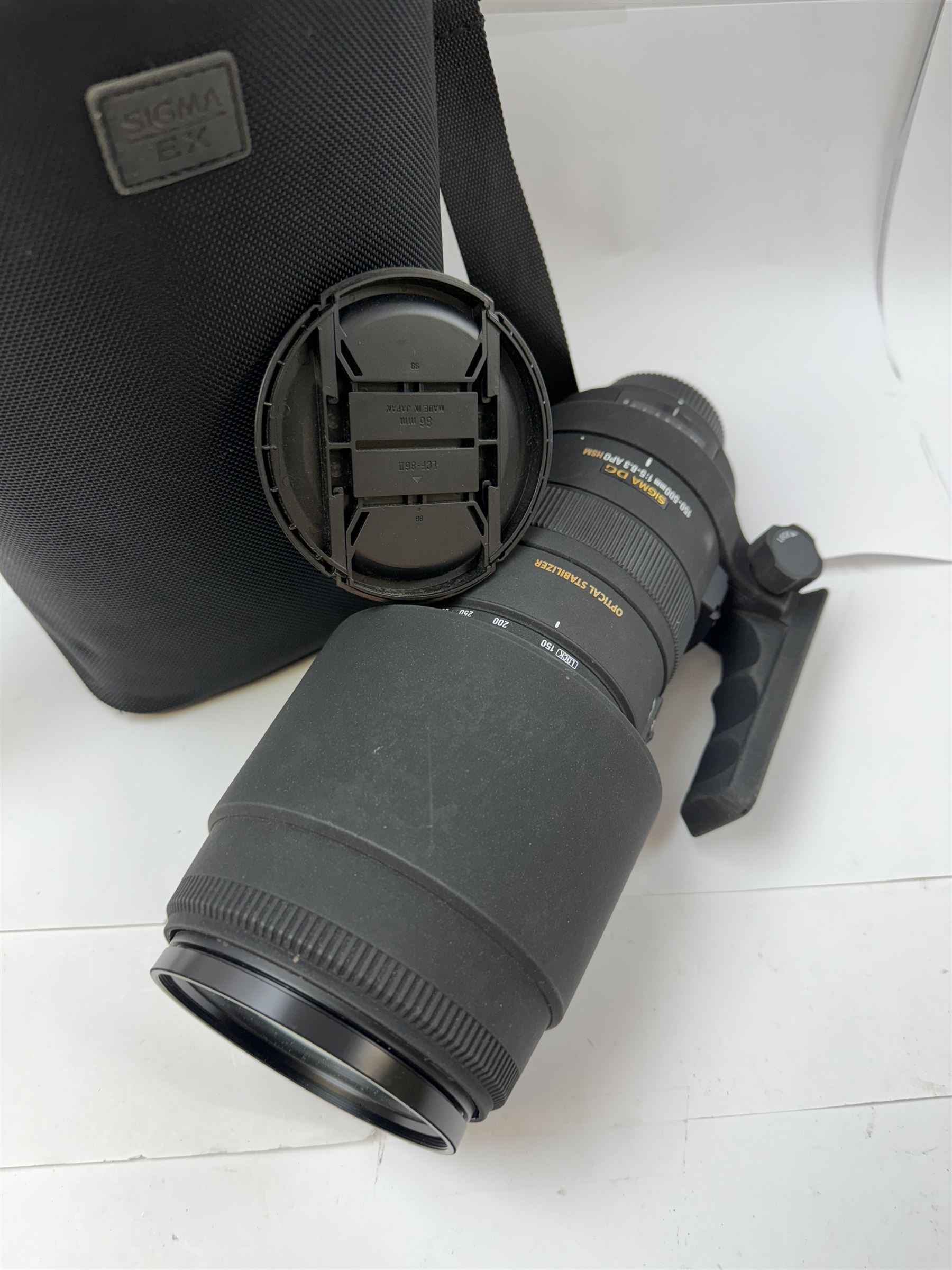 Sigma DG 150-500mm 1:5-6.3 APO HSM optical stabiliser lens, serial no. 1039530, with two lens caps and Sigma carry case

