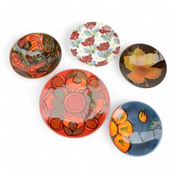 Three Poole pottery charges, in Wild Poppy pattern, Delphis pattern and Aegean pattern, to...