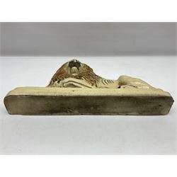 19th century salt-glazed stoneware door porter, as a recumbent lion, upon a stepped plinth base, H32