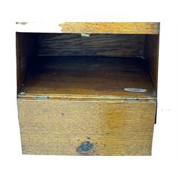 Early 20th century oak vanity stand, with circular adjustable mirror, brass towel rails to the sides, marble inset top and upper compartment, over additional storage compartment with hinged front, on splayed supports with stretchers