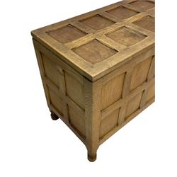 Sid Pollard (ex. Mouseman) - Yorkshire oak blanket chest, all over panelling, enclosed by hinged lid, on octagonal feet, interior plaque inscribed 'S. Pollard, Bagby, Thirsk, Yorks' 