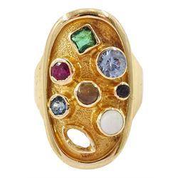 Gold multi gemstone set ring, bezel set stones including topaz, ruby and emerald in an oval setting