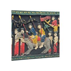 Rectangular relief carved and painted wall hanging panel, depicting ceremonial procession with soldiers and flag bearers on horses and elephants