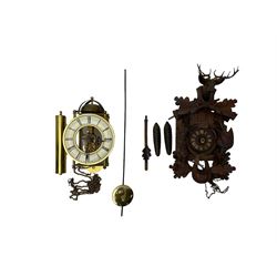 A 20th century cuckoo clock and weight driven German wall clock.