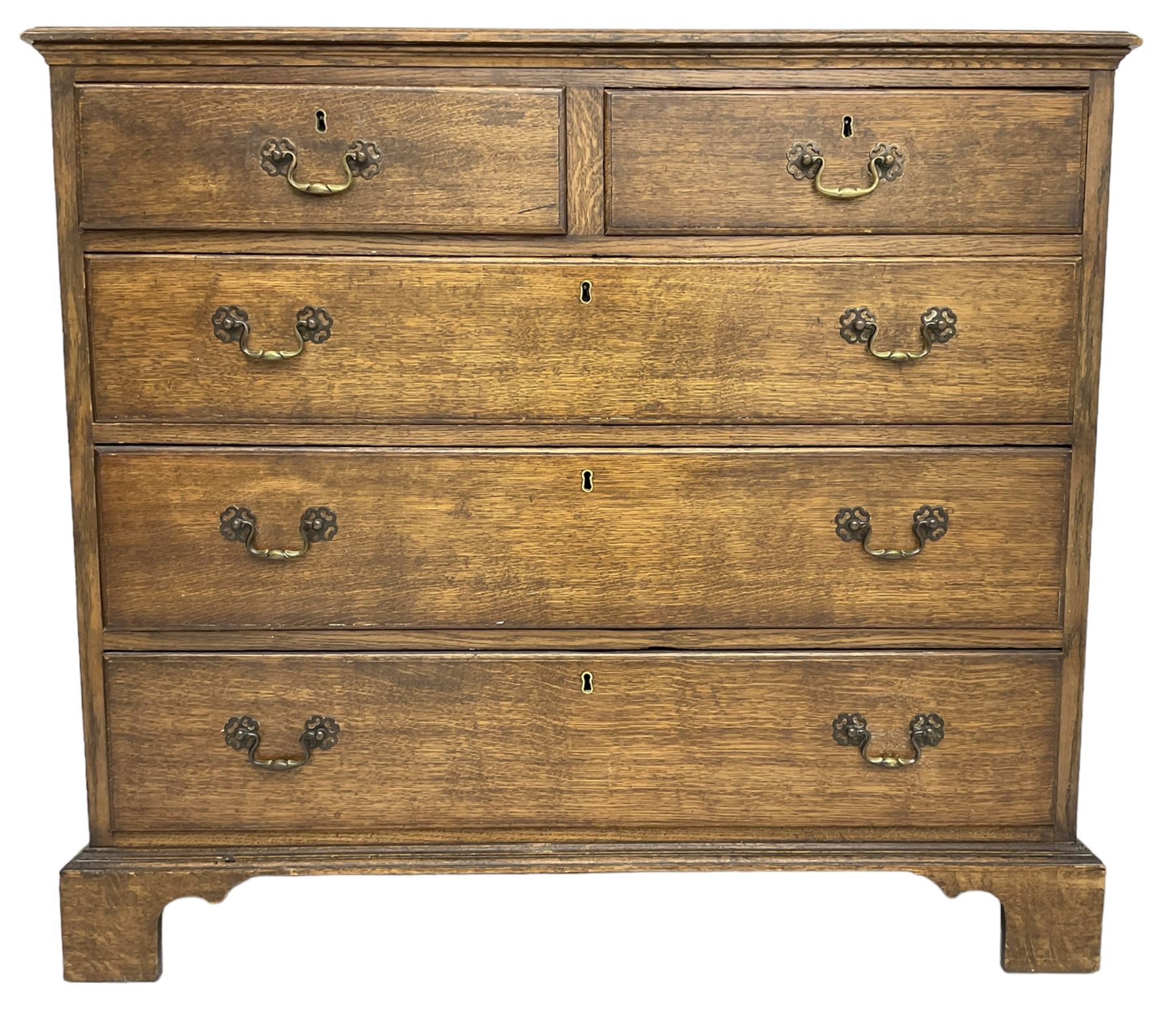 Early 20th century Georgian design oak chest, fitted with two short over three long drawers, lower moulded edge over bracket feet